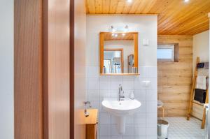 a bathroom with a sink and a mirror at Ferienwohnung Lavendel Hofgeismar in Hofgeismar +28 photos