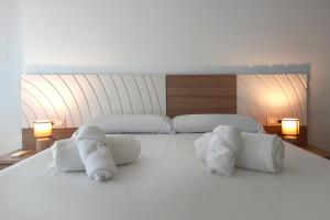 Postel nebo postele na pokoji v ubytování Apartamentos Villa Azul + 17 fotografií