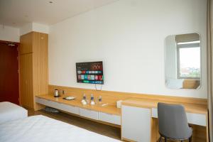 Postel nebo postele na pokoji v ubytování Min Min Hotel