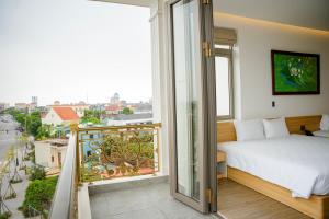Postel nebo postele na pokoji v ubytování Min Min Hotel