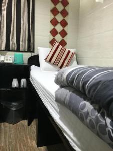 Letto o letti in una camera di Reliance Inn