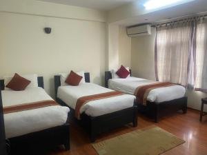Letto o letti in una camera di Thamel Eco Resort