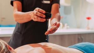 a woman getting her hair washed by a massage therapist at Labranda Marieta & Spa - Adults Only in Playa del Ingles