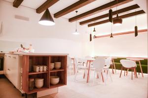 a kitchen and dining room with a table and chairs at Hotel Old Sarajevo in Sarajevo