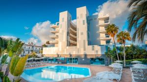 a hotel with a swimming pool and palm trees at Labranda Marieta & Spa - Adults Only in Playa del Ingles