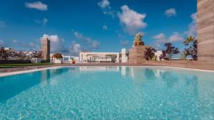 a large swimming pool in front of a building at Labranda Marieta & Spa - Adults Only in Playa del Ingles