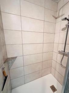 a bathroom with a shower with white tiles at Stay at La Chaume Les Barges 40 in Les Sables-dʼOlonne +15 photos