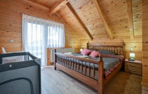 a bedroom with a bed in a log cabin at Villa Nina by Villas Guide in Ludbreg +27 photos