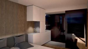 Habitación con cama, sofá y cocina. en Aurum, en Ischgl