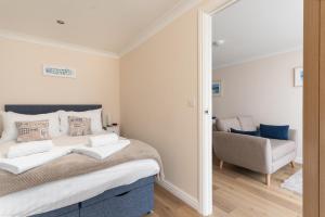 Ένα ή περισσότερα κρεβάτια σε δωμάτιο στο 6 Lower Talland Apartments