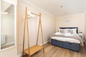 Ένα ή περισσότερα κρεβάτια σε δωμάτιο στο 6 Lower Talland Apartments +5 φωτογραφίες