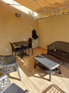 A seating area at ASFODELIA-STELLA
