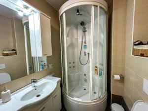 a bathroom with a shower and a sink at Verde 22 with Garage in Sarajevo +25 photos