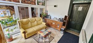 a living room with a couch and a table at La Dolce Vita Central in Braşov