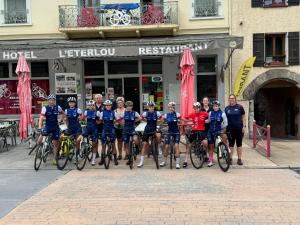 a group of people on bikes in front of a building at Eterlou in La Chambre