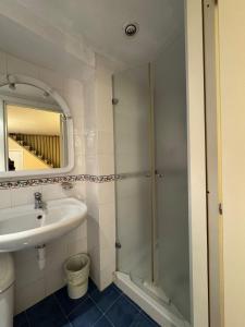 a bathroom with a shower and a sink at A Casitta 2 Luxury Apartments in Taormina