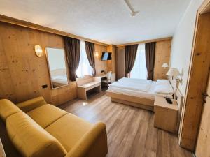Posteľ alebo postele v izbe v ubytovaní Hotel Angelica