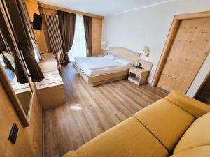 Posteľ alebo postele v izbe v ubytovaní Hotel Angelica