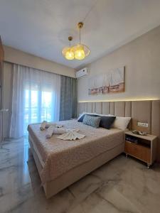 Postel nebo postele na pokoji v ubytování Maya apartments Hanioti