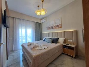 Postel nebo postele na pokoji v ubytování Maya apartments Hanioti