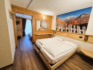 Posteľ alebo postele v izbe v ubytovaní Hotel Angelica