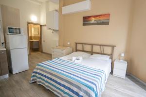 Posteľ alebo postele v izbe v ubytovaní Residence Rimini Mare