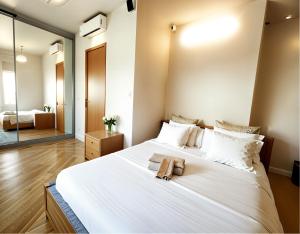 Rúm í herbergi á Syllas Grand Resort - Executive View Villa 1