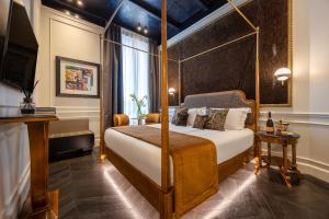 a bedroom with a canopy bed and a window at HT6 Maison in Rome +14 photos