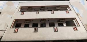 an aerial view of a white building with windows at Chhatrapati Residency Tirupati in Tirupati