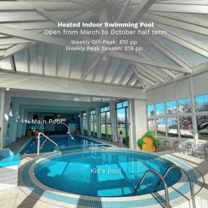 a swimming pool in a building with a swimming pool at 27 Sea Valley Chalet in Bucks Mills