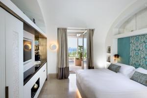 Posteľ alebo postele v izbe v ubytovaní Villa Marina Capri