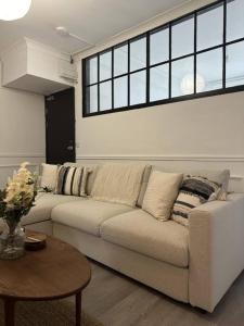 a living room with a couch and a table at Modern Apartment Near Newport City Centre! in Newport