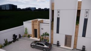 a car is parked outside of a building at منتجعات رغيد الفندقية الشفا شرقي in Hail