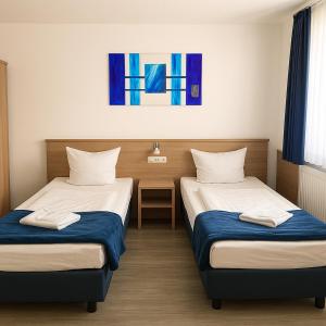 Postel nebo postele na pokoji v ubytování Sunny Hotel Straubing