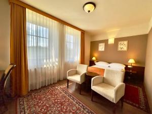 Posteľ alebo postele v izbe v ubytovaní Hotel Słoneczny Młyn