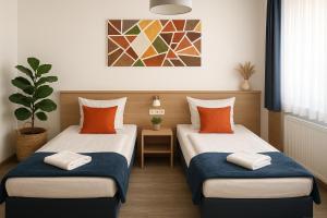 Postel nebo postele na pokoji v ubytování Sunny Hotel Straubing