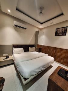 Ένα ή περισσότερα κρεβάτια σε δωμάτιο στο Hotel Seventh Heaven