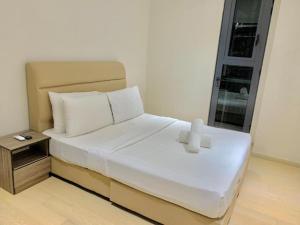 Giường trong phòng chung tại Star KLCC Dynamic Hospitality