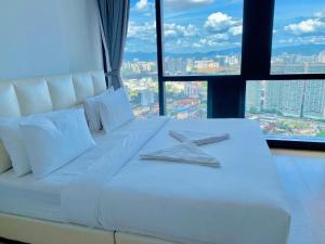 Giường trong phòng chung tại Star KLCC Dynamic Hospitality