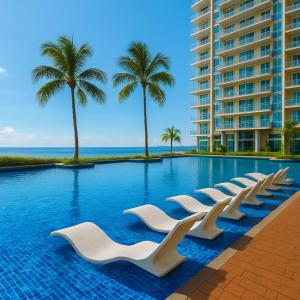 a swimming pool with white chairs and palm trees at Elegant 1BR near Solaire, Okada, Mall of Asia in Manila
