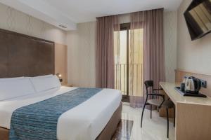 Posteľ alebo postele v izbe v ubytovaní Hotel Gótico