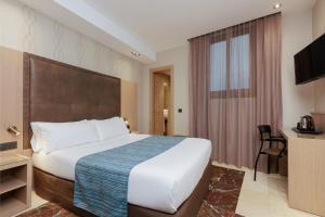 Posteľ alebo postele v izbe v ubytovaní Hotel Gótico