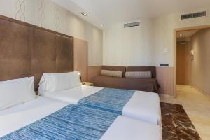 Posteľ alebo postele v izbe v ubytovaní Hotel Gótico