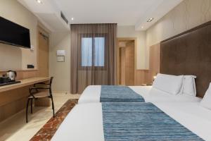 Posteľ alebo postele v izbe v ubytovaní Hotel Gótico