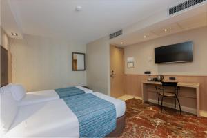 Posteľ alebo postele v izbe v ubytovaní Hotel Gótico