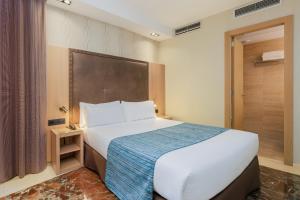 Posteľ alebo postele v izbe v ubytovaní Hotel Gótico