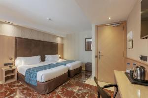 Posteľ alebo postele v izbe v ubytovaní Hotel Gótico