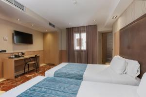 Posteľ alebo postele v izbe v ubytovaní Hotel Gótico