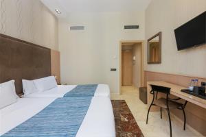Posteľ alebo postele v izbe v ubytovaní Hotel Gótico