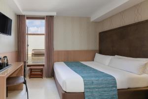 Posteľ alebo postele v izbe v ubytovaní Hotel Gótico